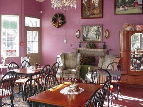 A photo of the main dining area at Scotto's, showing the wingback chairs